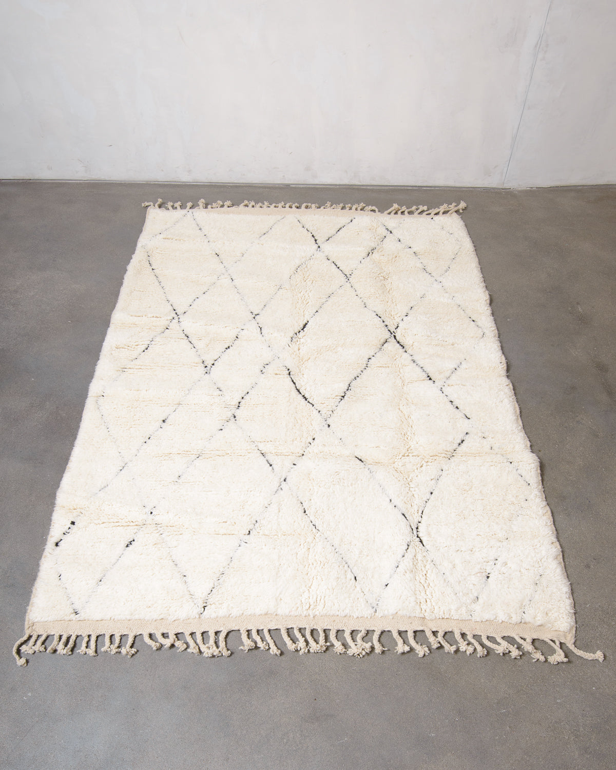 Modern, designer, handcrafted Berber rug from Morocco. Beniourain carpet with minimalist design, natural wool pile and a fluffy texture.